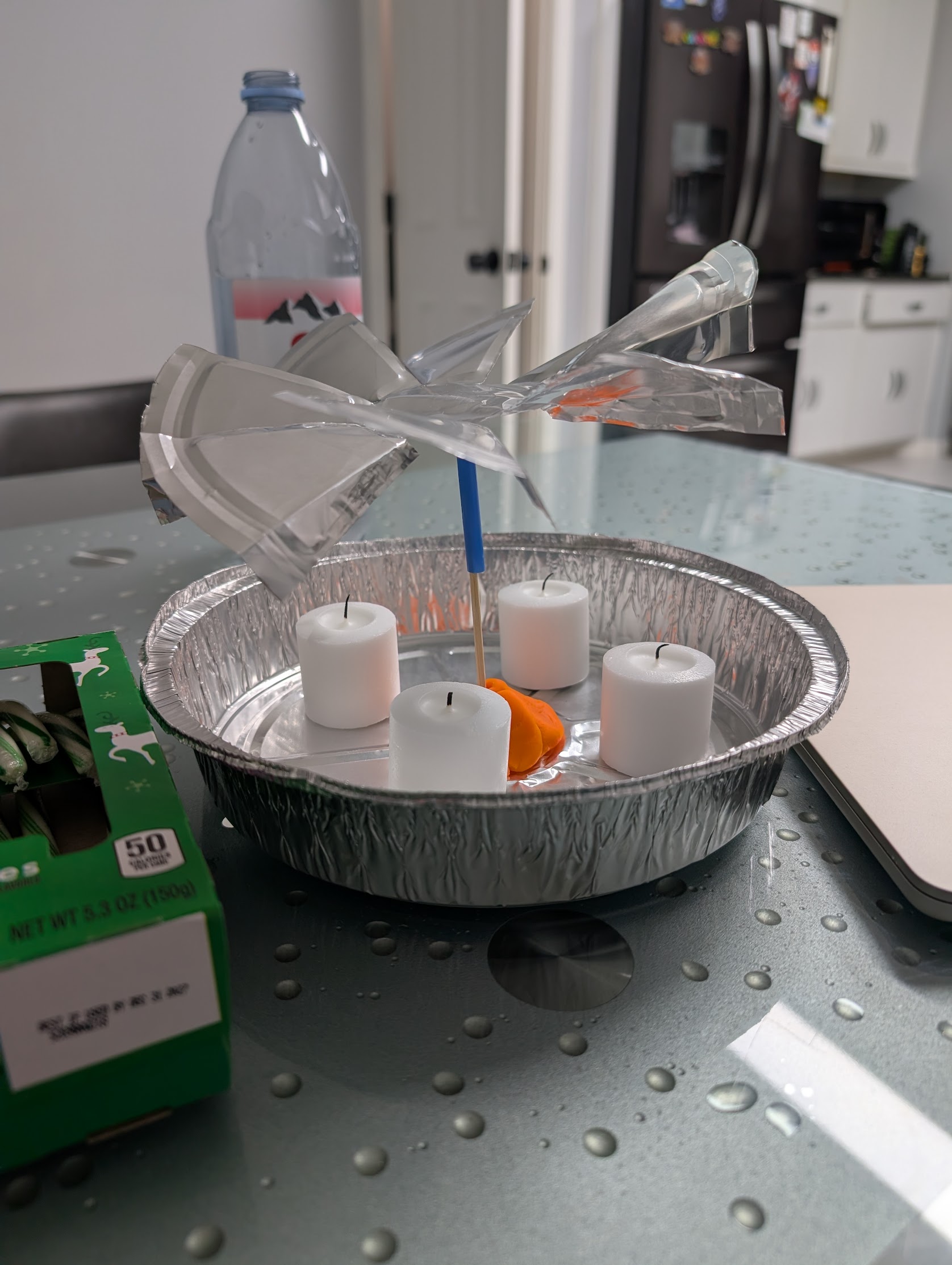 Tea light candles and materials for candle carousel experiment